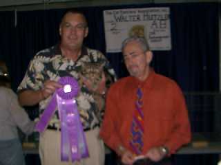 Dick Shannon holding Java Gold and Allbreed finals under Walter Hutzler